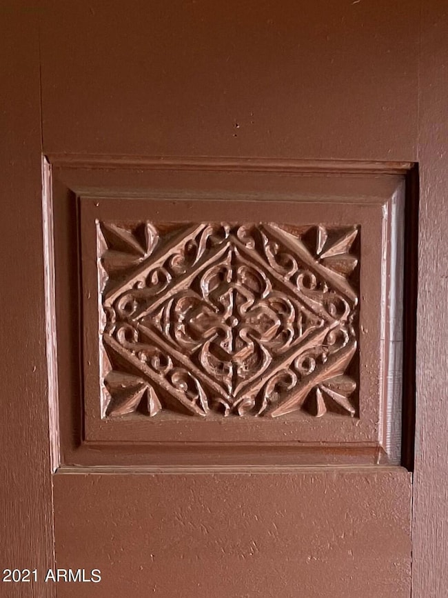 Solid wood front door with carved accent