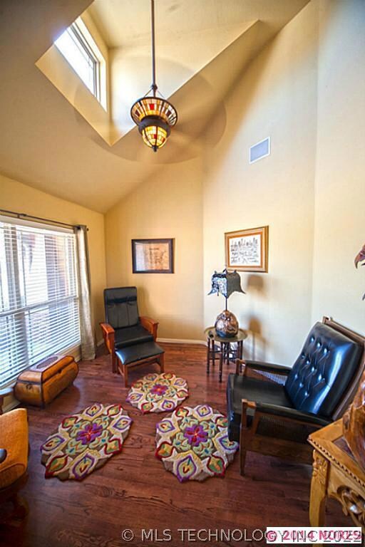 The dramatic ceiling carries into this front room