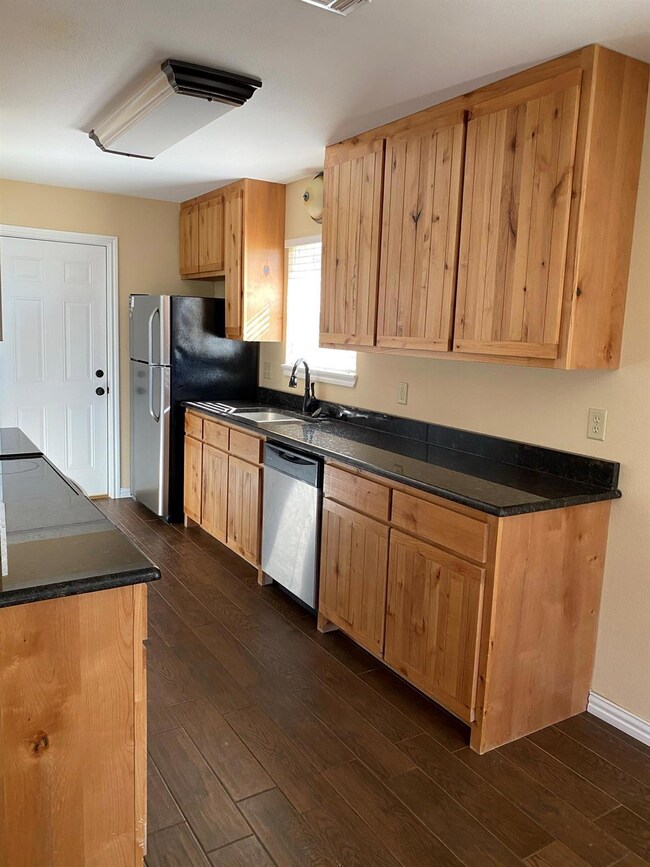 Kitchen with appliances with stainless steel finis