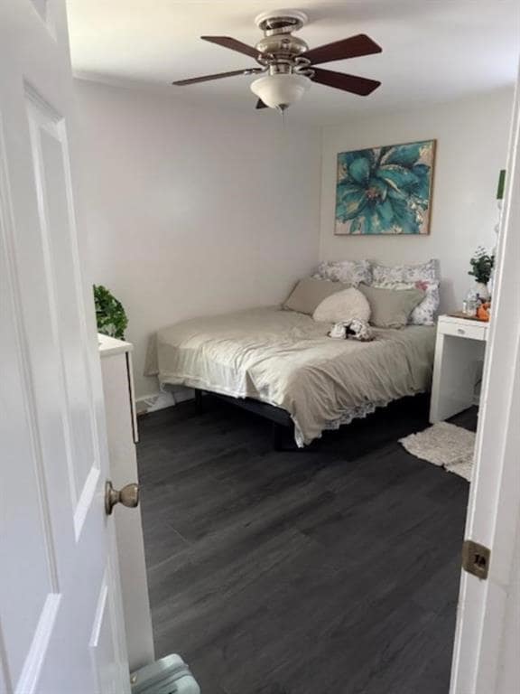 Bedroom featuring dark wood finished floors and ceiling fan
