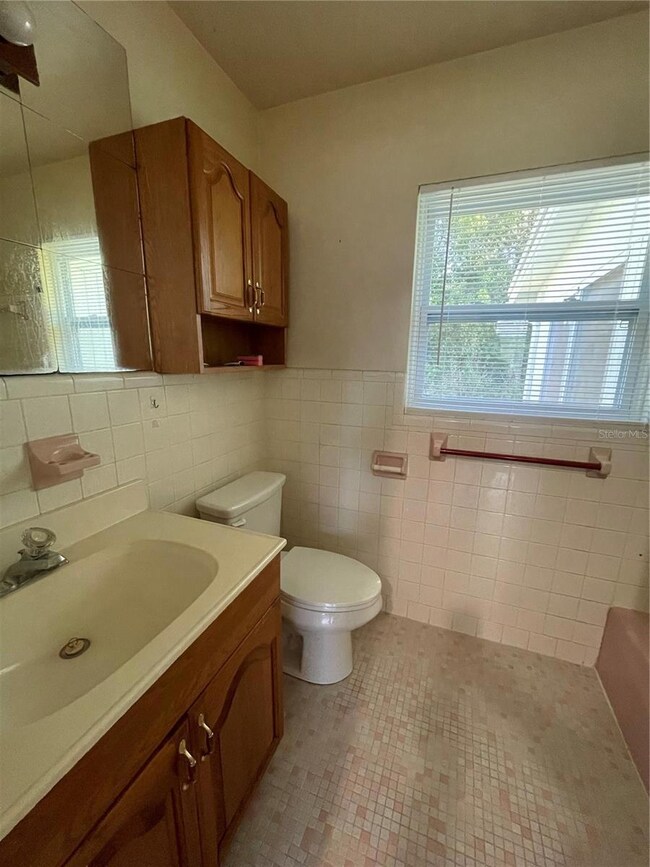 Full bathroom with tub