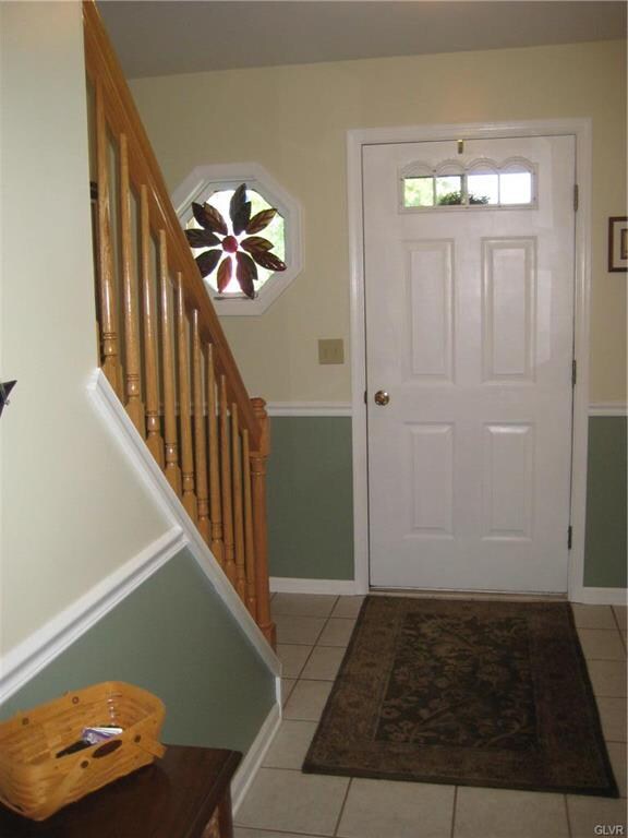 View of foyer showing open staircase.