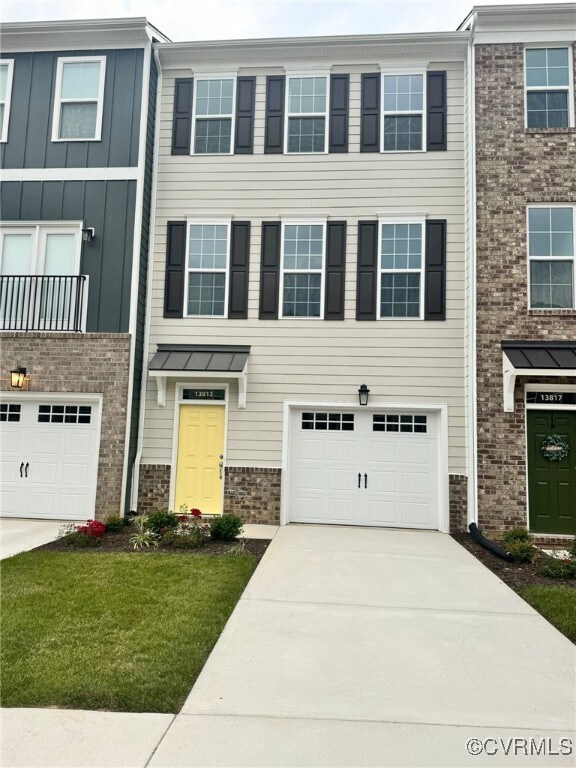 View of property with a garage