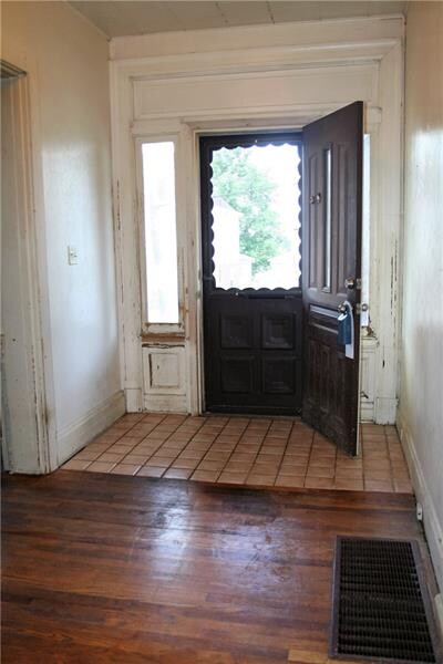 Front door with original sidelights and trim