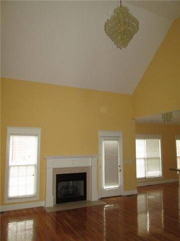 Living Room with Vaulted Ceiling and Fireplace