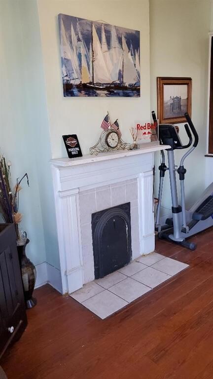 Classic fireplace with original wood floors.