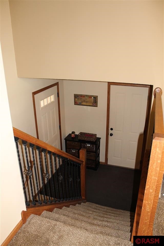 Looking downstairs at your front door and foyer ar