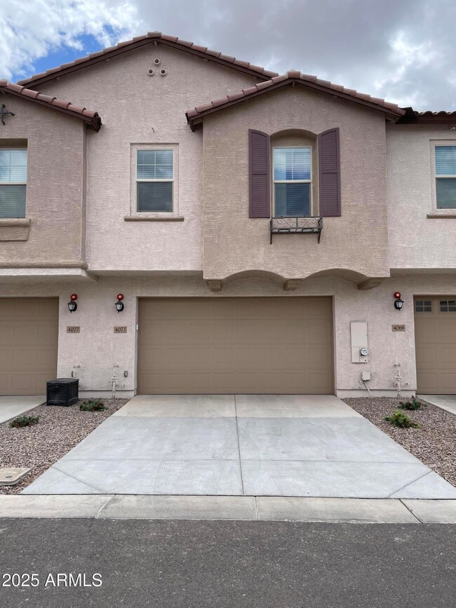 Back of home with garage