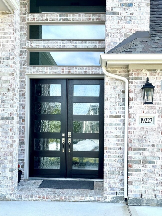 This is a modern home entrance featuring a stylish