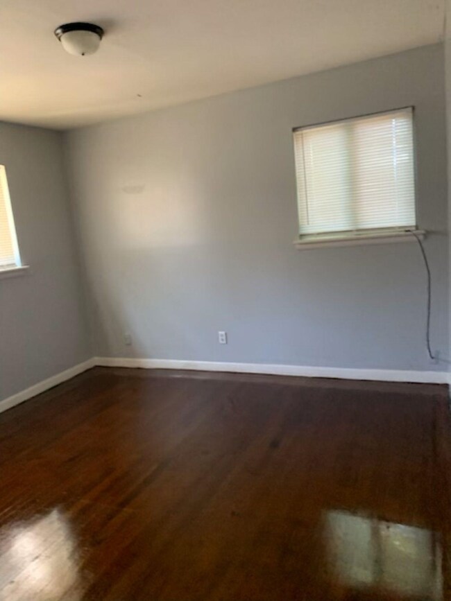 Empty room with wood-type flooring