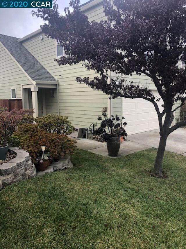 Private Entrance on side of home with small patio.