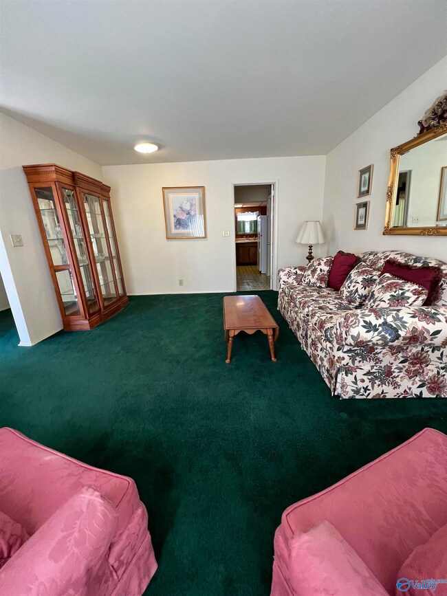 Spacious living room with kitchen access.