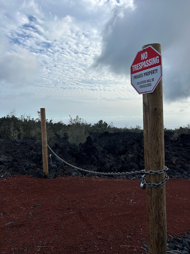 Posts with chain link and lock to secure entrance.