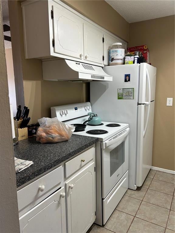 Kitchen with light tile patterned floors, range, v
