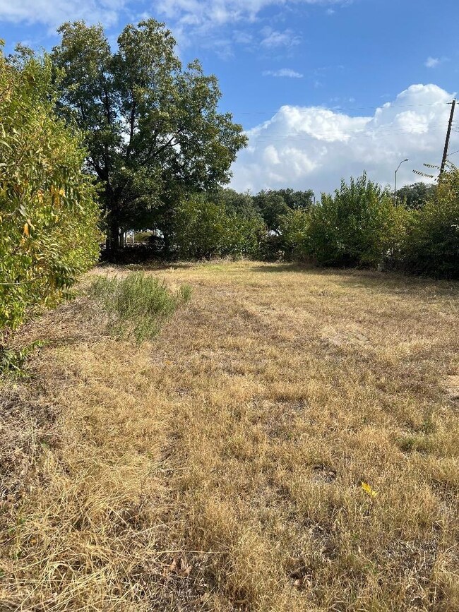 View of yard with a rural view