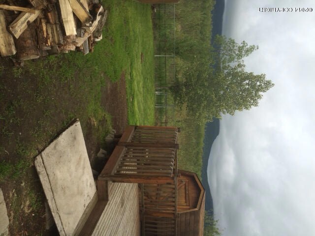Fenced yard with mountain views