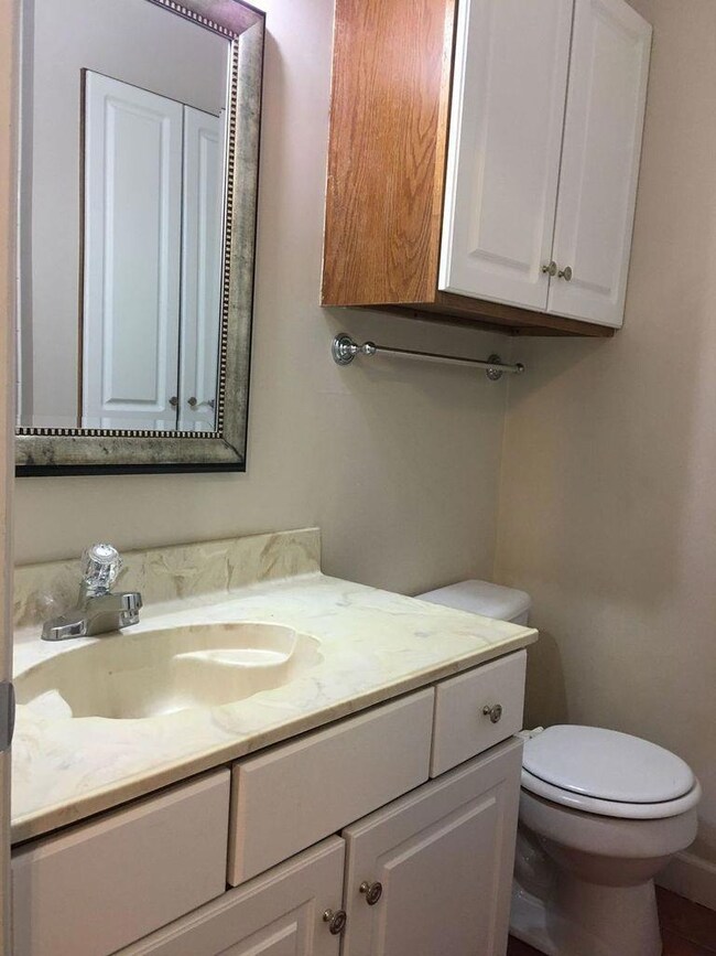 Bathroom with toilet and vanity