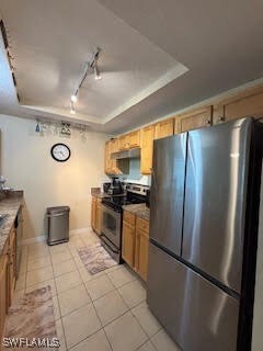 Kitchen featuring stainless steel appliances, a ra
