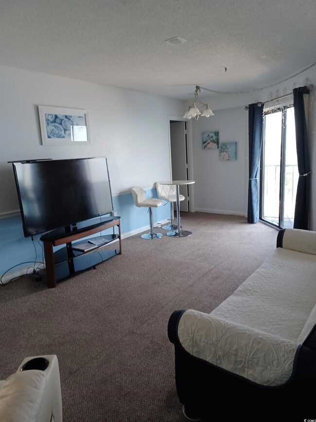 Living room featuring carpet flooring