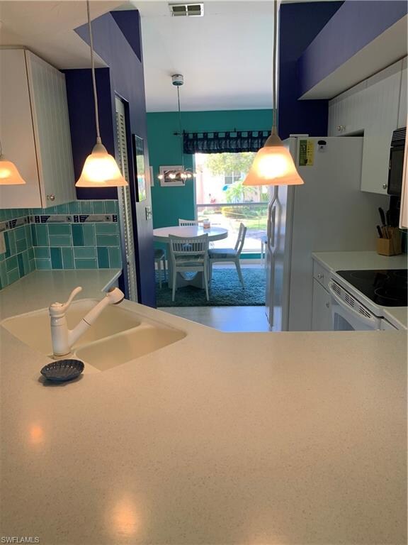 Looking through kitchen to dining area.