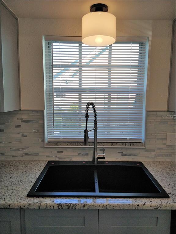 Ceramic tile backsplash.
