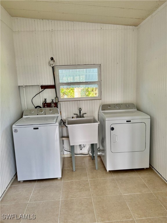 laundry room with laundry tub and wainscoting