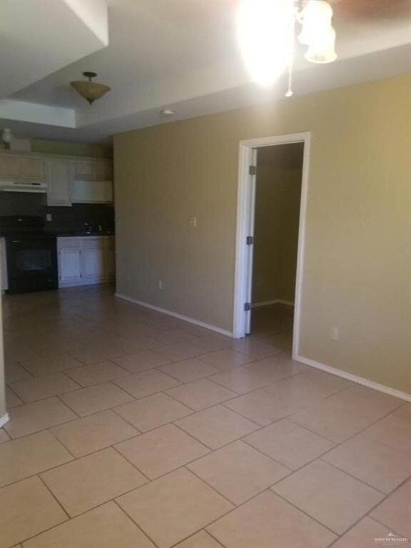 Unfurnished living room with light tile patterned flooring