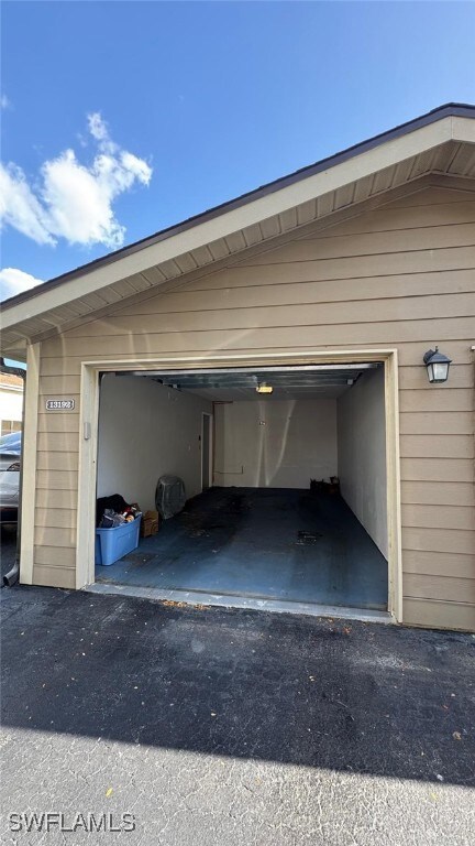 Garage featuring aphalt driveway