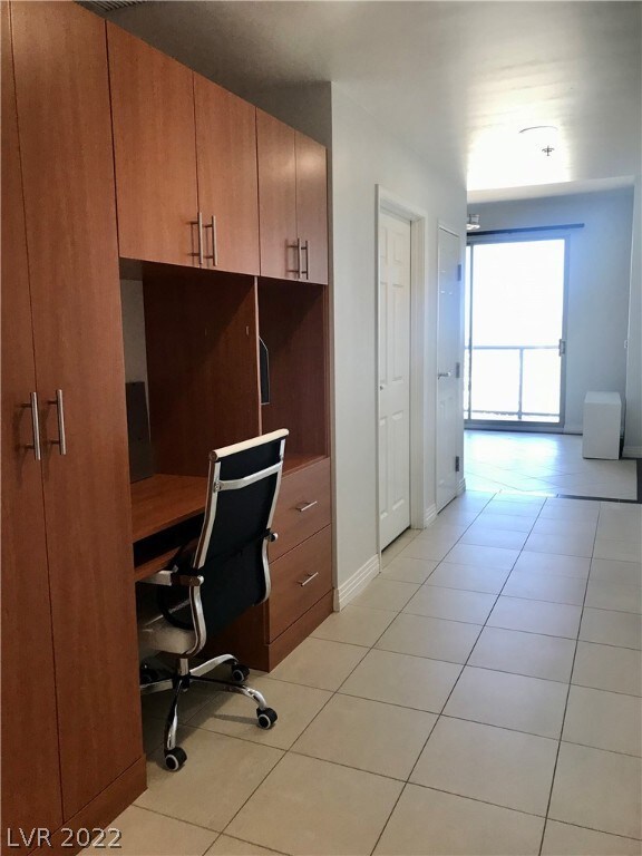 CA closet buit in.  Desk, file cabinets, large coa