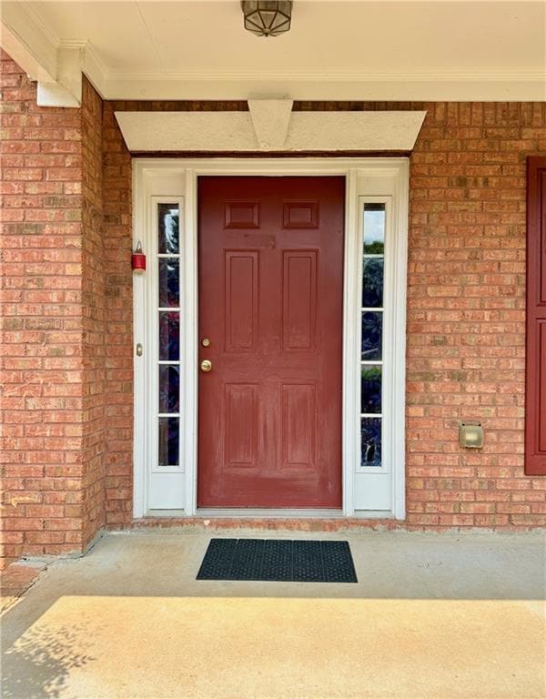 Property entrance with brick siding
