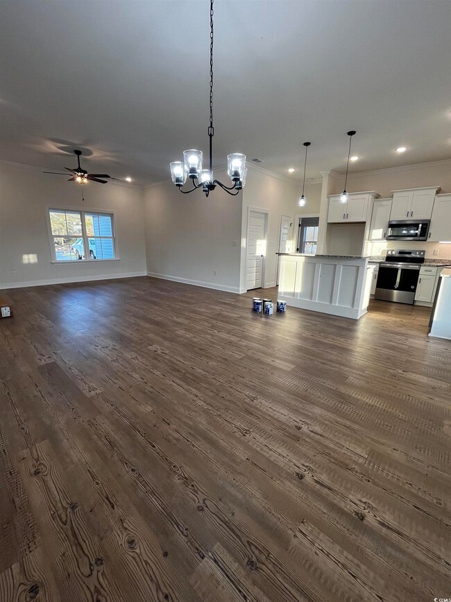 Interior space with pendant lighting, ceiling fan 