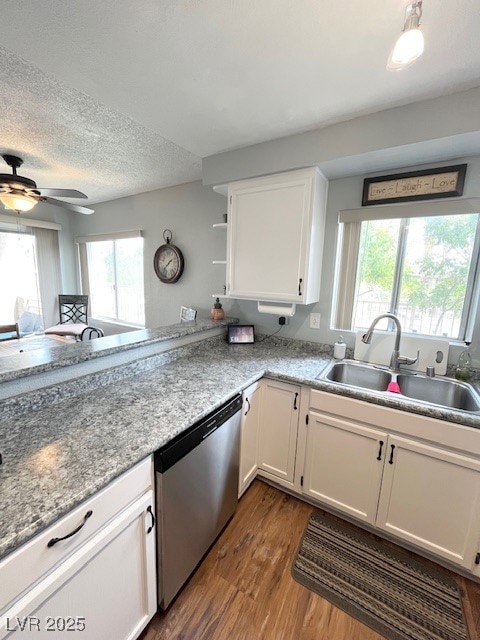 Kitchen featuring a sink, dark wood-style floors,