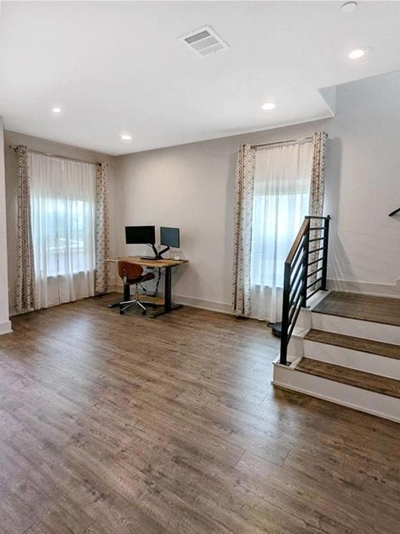 Office space featuring baseboards, wood finished 