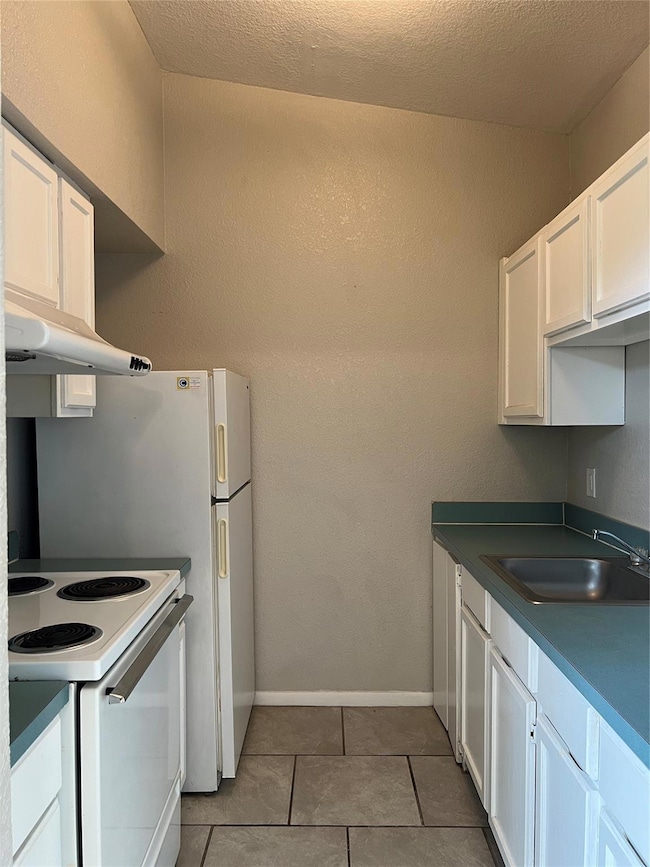 This view of the kitchen shows the stainless steel