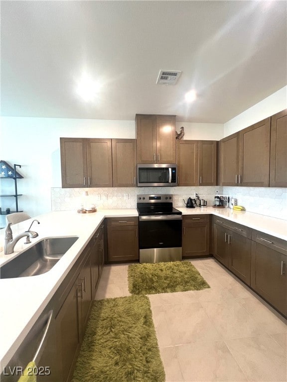 Kitchen featuring stainless steel appliances, deco