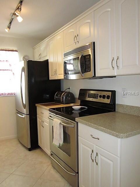 Kitchen with stainless steel appliances and modern