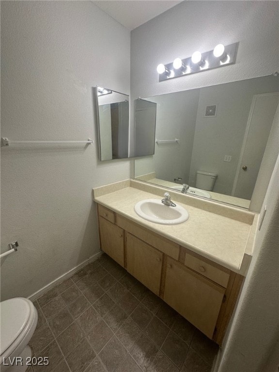 Bathroom featuring vanity and tile patterned floor