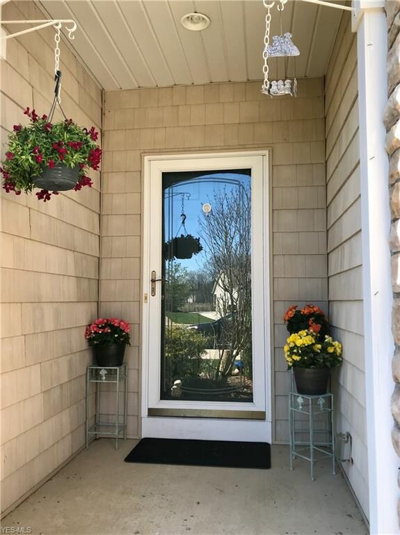 Covered front porch, upgraded storm door.