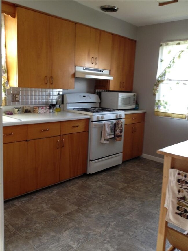 Cute eat-in kitchen with newer flooring.