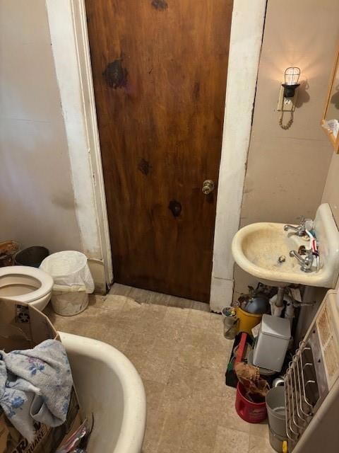 Bathroom with tile patterned flooring, a bathing t