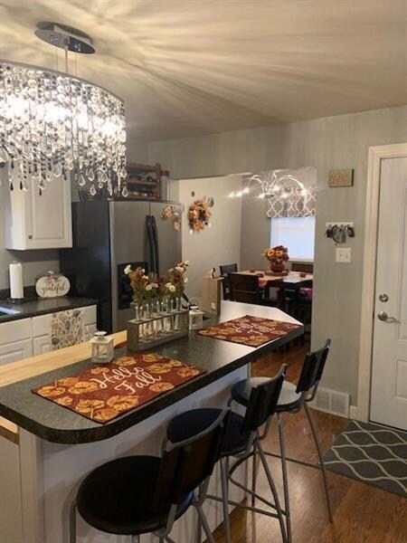 Notice the breakfast nook off from the kitchen.
