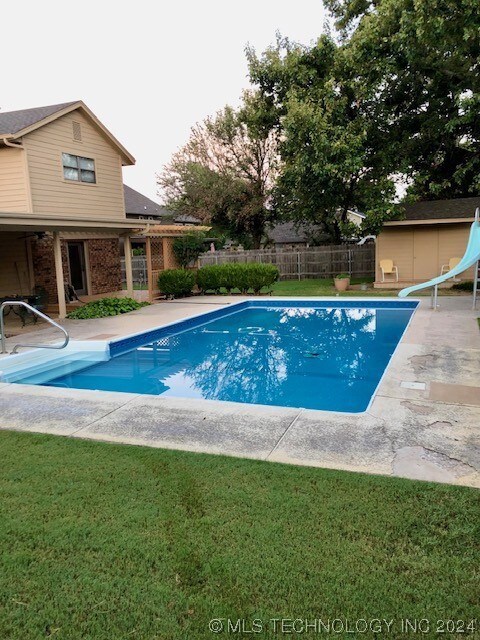 inground pool in back yard