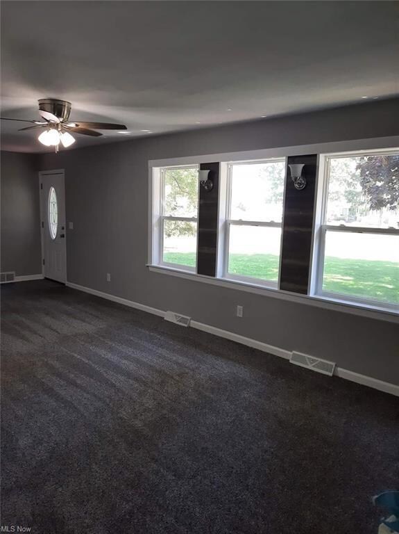 Unfurnished room with a wealth of natural light, d