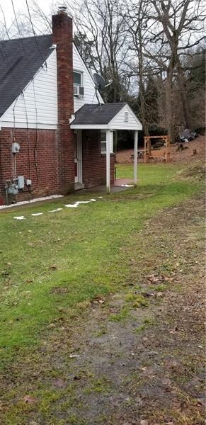 Covered side porch entrance to the kitchen