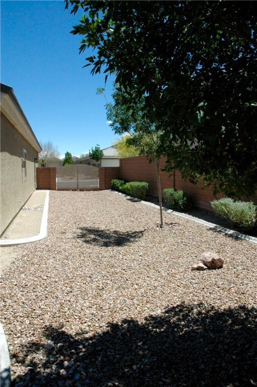 Side yard has space for RV parking and RV gate.