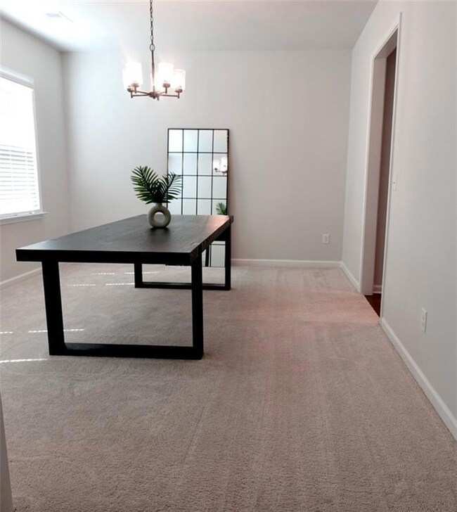 Unfurnished dining area featuring a notable chande