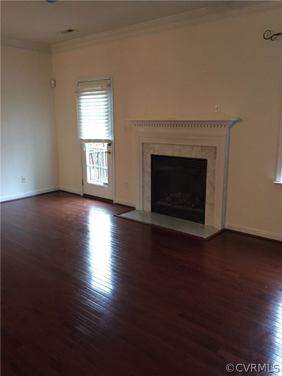 Family Room with walk out deck and FP.