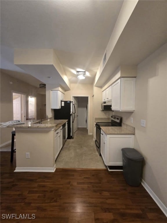 Kitchen with appliances with stainless steel finis