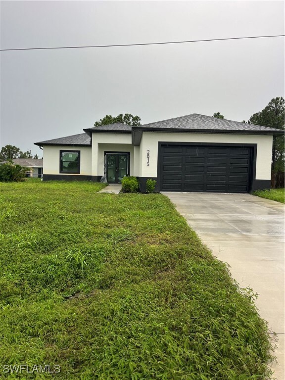 View of front of property featuring french doors,