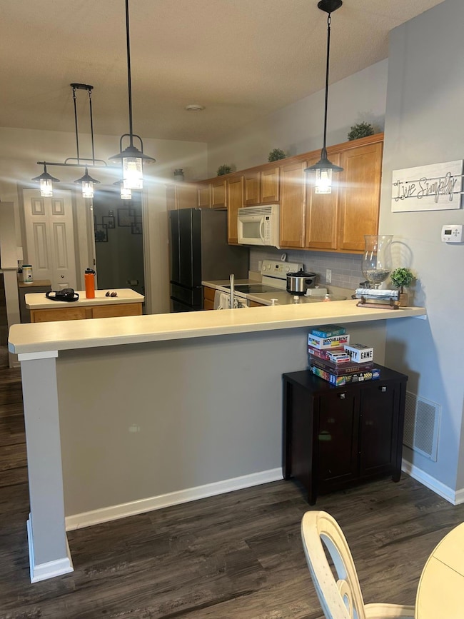 Kitchen and barstool dining area